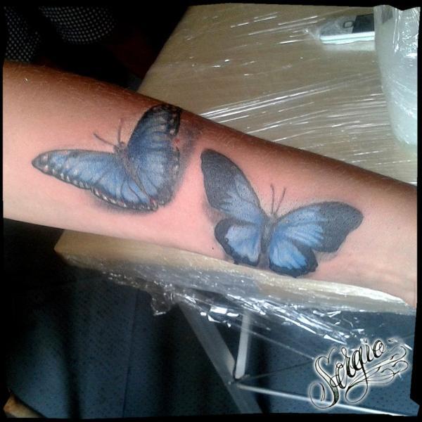 Фото тату Голубые бабочки на руке