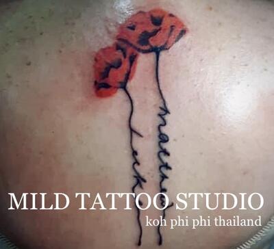 Red flowers tattoo bamboo tatt